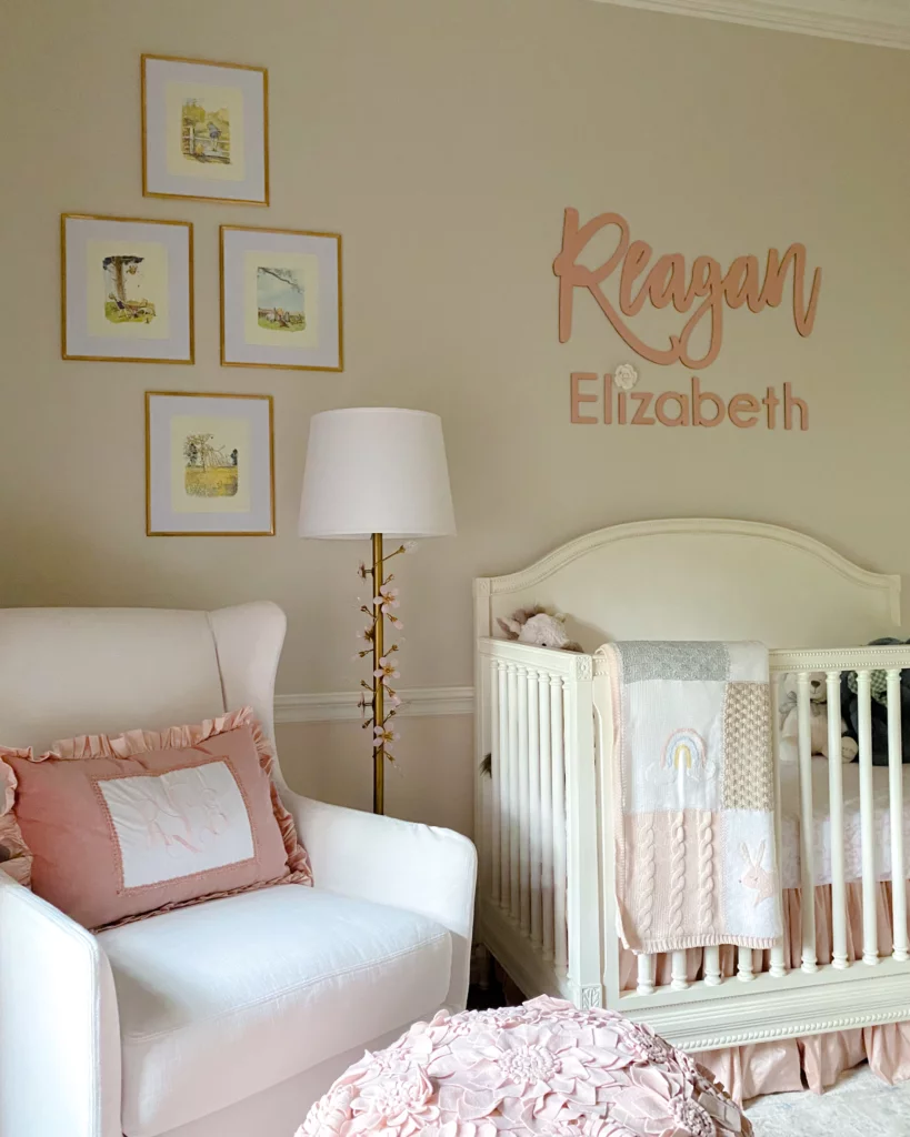 designing a nursery, baby girl nursery, pink nursery, nursery crib, nursery floor lamp, nursery artwork, nursery drapery, nursery stuff animals, nursery chair, nursery pillows,