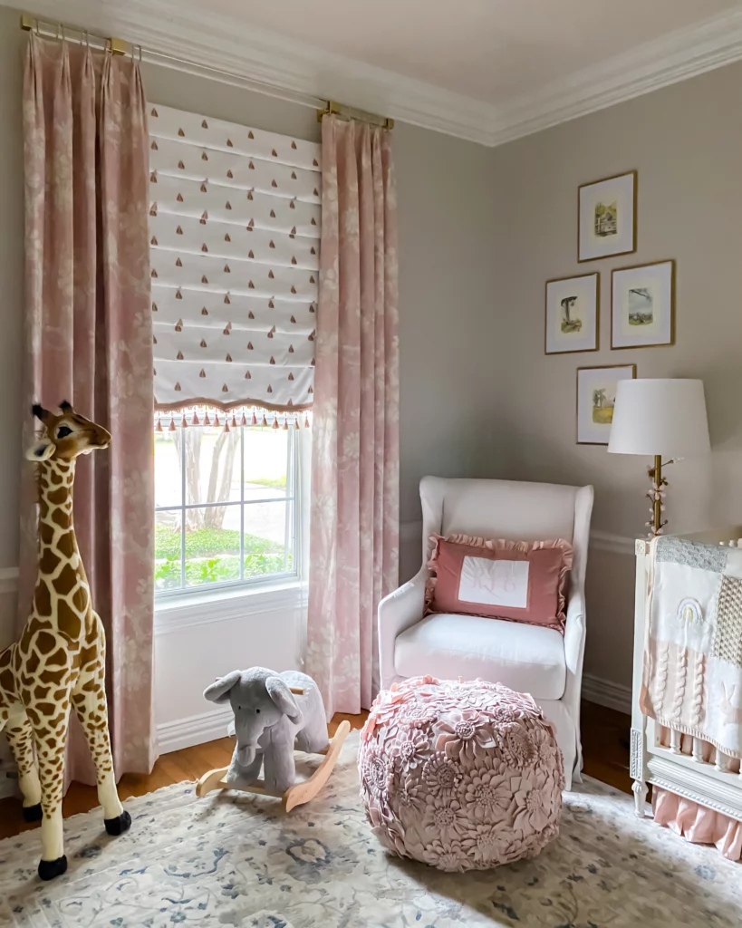 designing a nursery, baby girl nursery, pink nursery, nursery crib, nursery floor lamp, nursery artwork, nursery drapery, nursery stuff animals, nursery chair, nursery pillows,